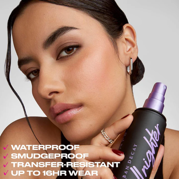 A model showcasing Urban Decay All Nighter Setting Spray.