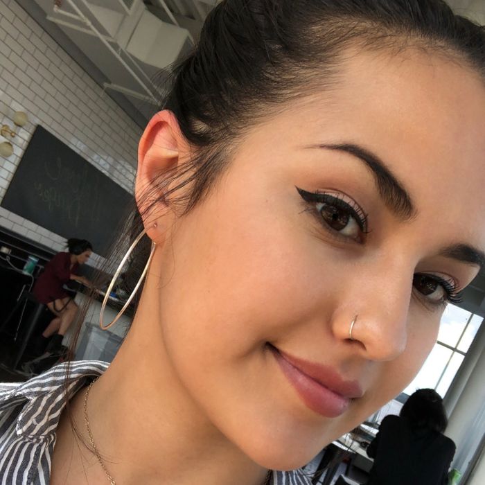 Mytour editor Kayla Suazo showcasing the concealer on her skin