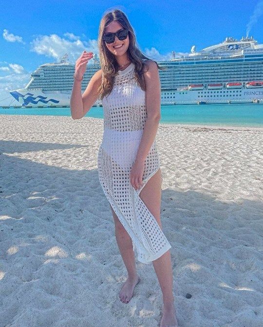 reviewer wearing the crochet dress