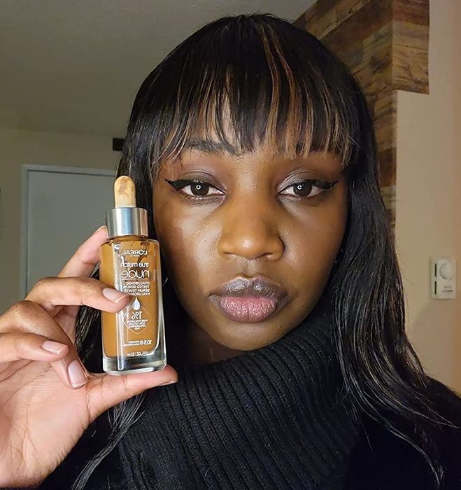 A reviewer showcasing the medium shade of the serum.