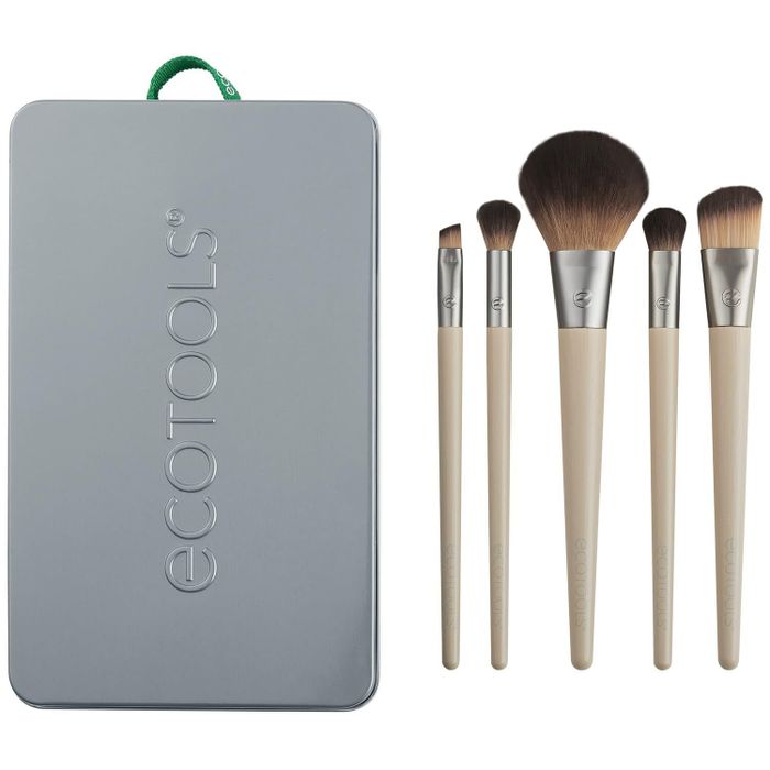 EcoTools makeup brushes displayed alongside their sleek gray packaging, featuring the brand logo