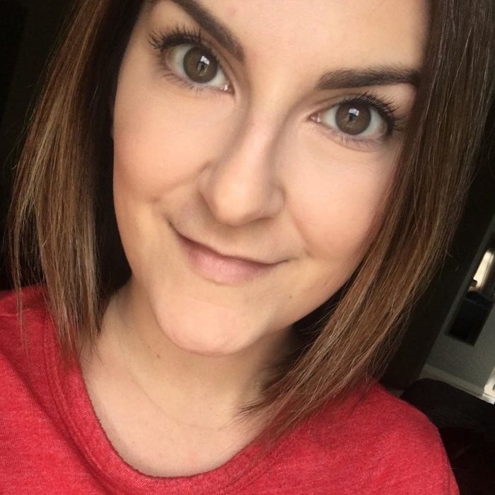 A reviewer showcasing the concealer applied to their skin