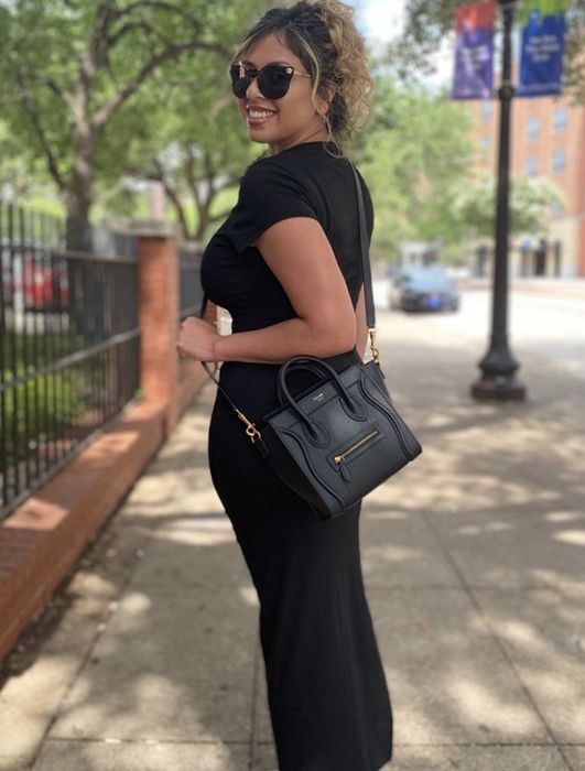 reviewer wearing the black top