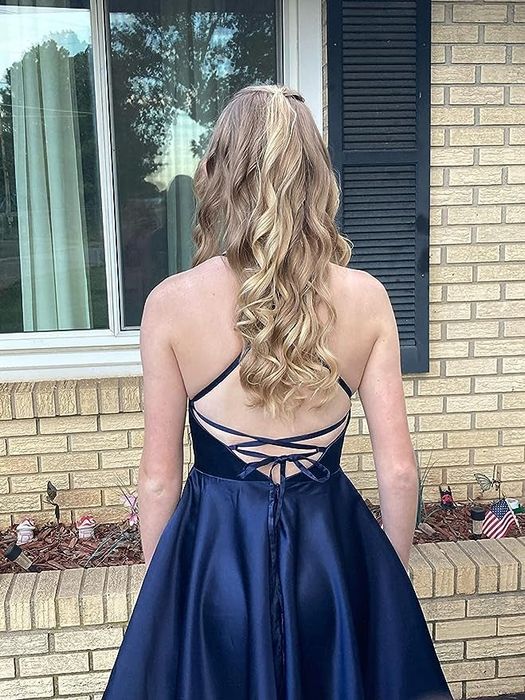 reviewer highlighting the back of a blue dress
