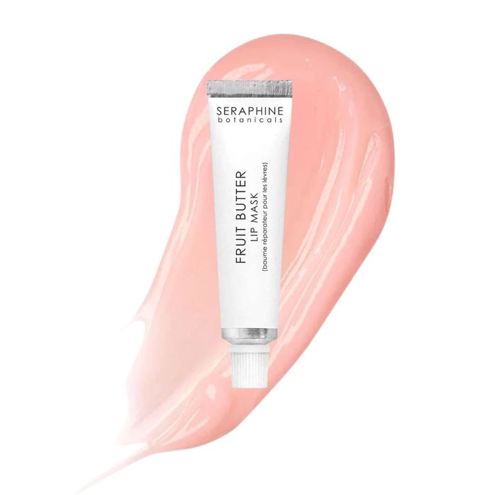 Seraphine Botanicals Fruit Butter Lip Mask tube resting on a glossy swipe background, showcased in a beauty shopping article.