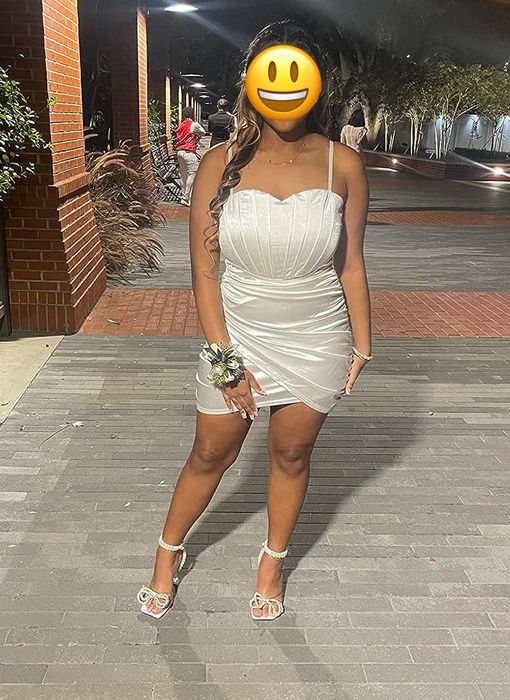 reviewer modeling a white dress