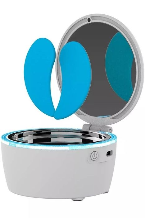 Portable face mask device featuring a mirror and power button for creating personalized skincare masks at home