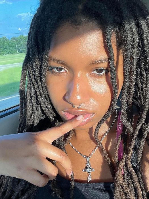 The reviewer showcasing luminous, glowing skin