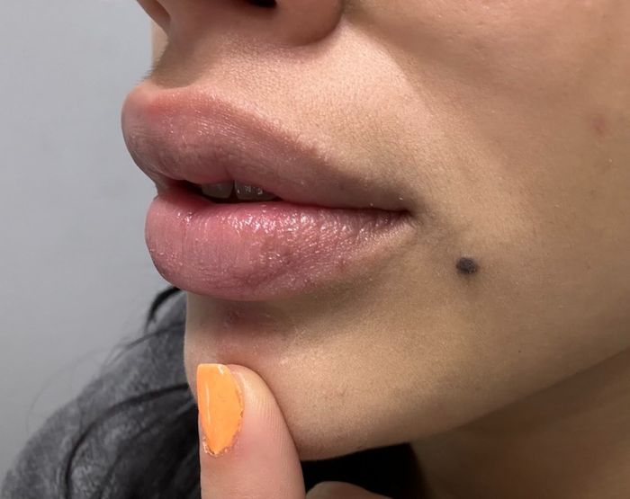Close-up of a reviewer’s well-moisturized lips