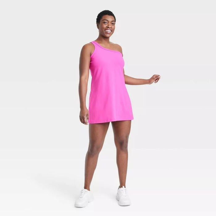 A model showcasing the pink one-shoulder dress