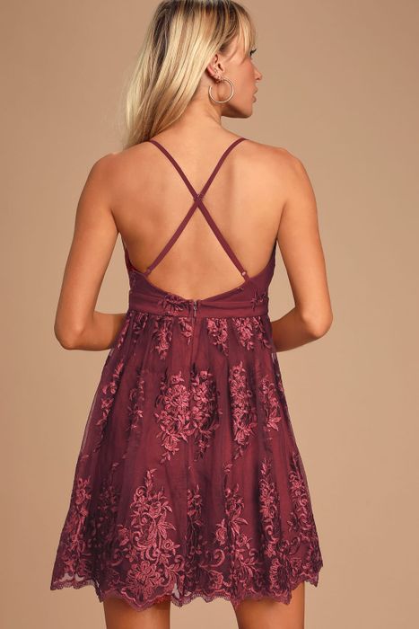 model highlighting the crisscross back of the dress