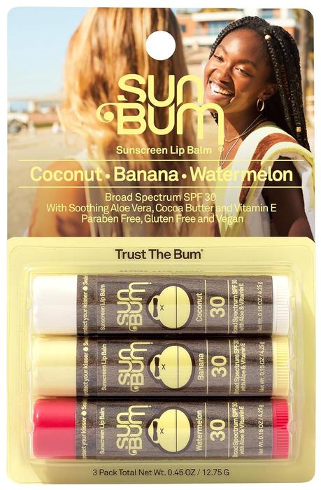A display of Sun Bum sunscreen lip balm 3-pack in coconut, banana, and watermelon flavors, shown in their packaging