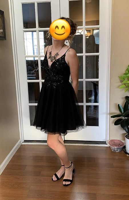 reviewer modeling a black lace tulle dress