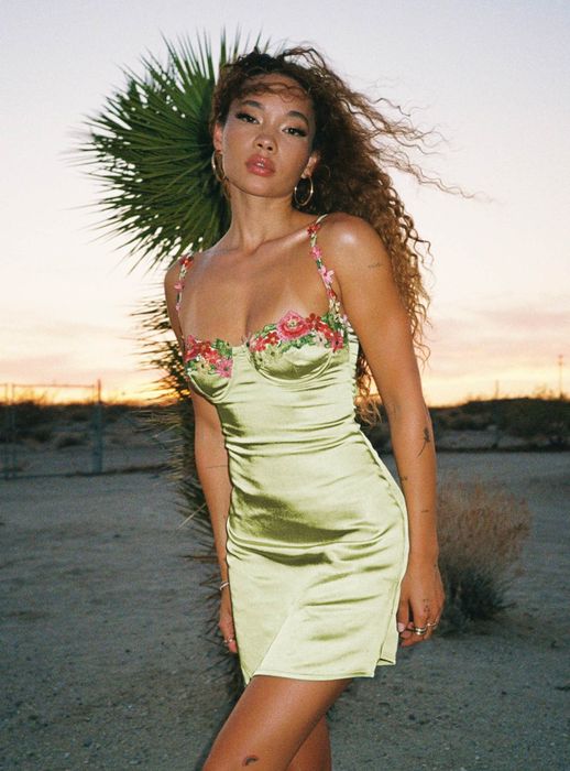 model wearing a sage green mini dress