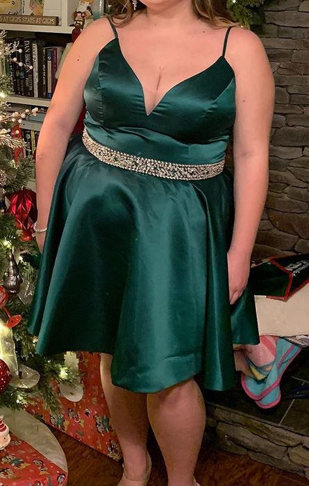 reviewer wearing a green dress