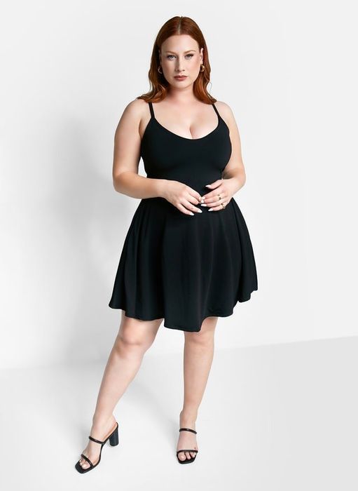model showcasing a black skater dress