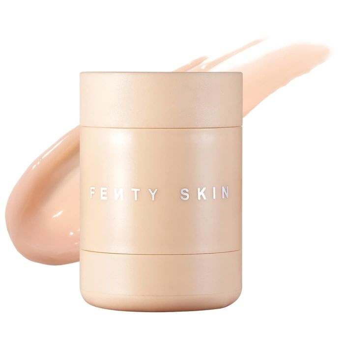 Fenty Skin’s luxurious skincare product in a sleek container with a creamy product swatch in the background