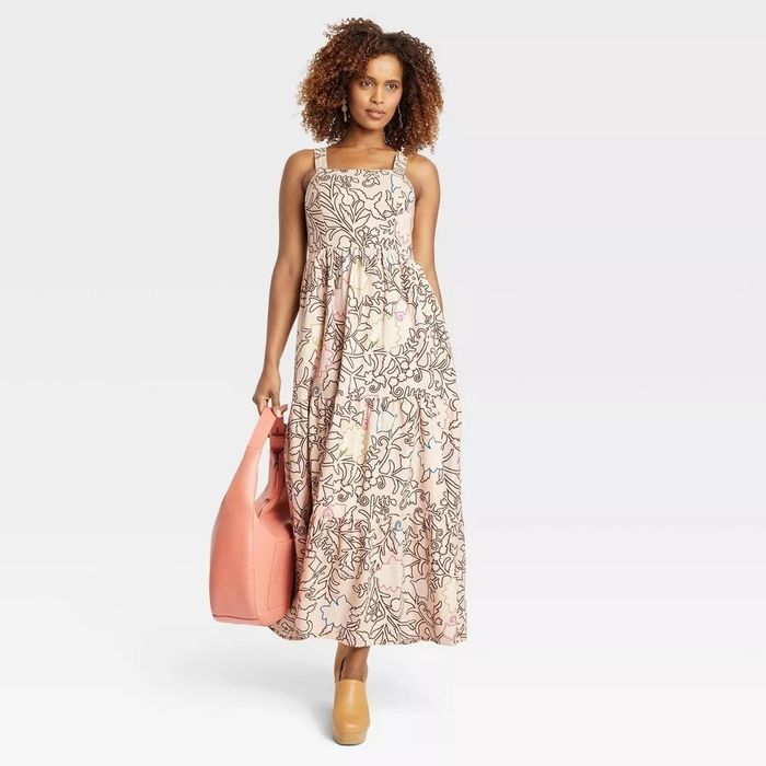 A model wearing the tropical printed dress