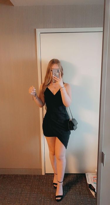 reviewer wearing a black dress