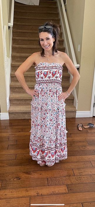 A customer review photo of them rocking the cream and pink dress
