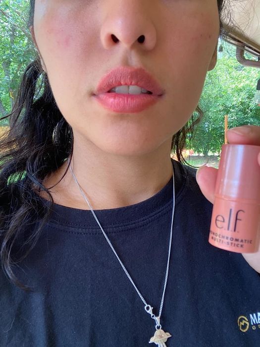 A reviewer applying the ELF multistick to create a versatile, monochromatic makeup look.