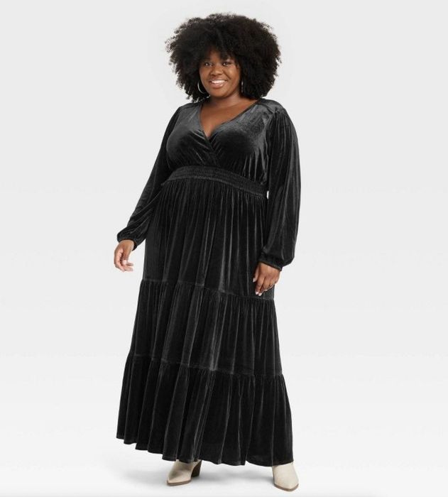 A sleek black velvet maxi dress that exudes elegance.