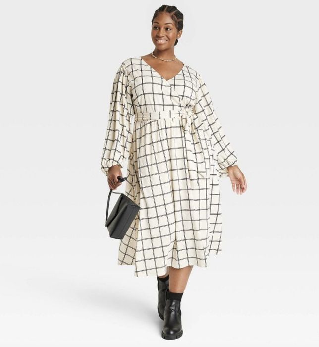 A cream and black checked long wrap dress, designed for those who appreciate timeless style.