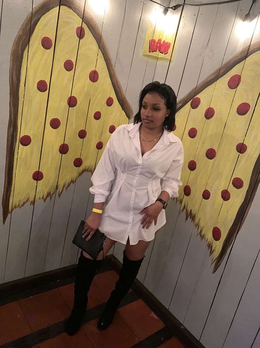Reviewer wearing the white dress