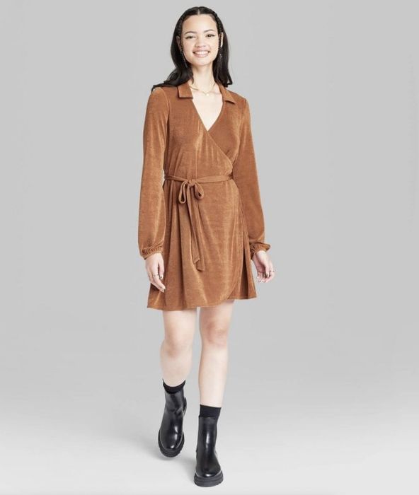 A brown wrap dress, designed to bring a sense of comfort and style.