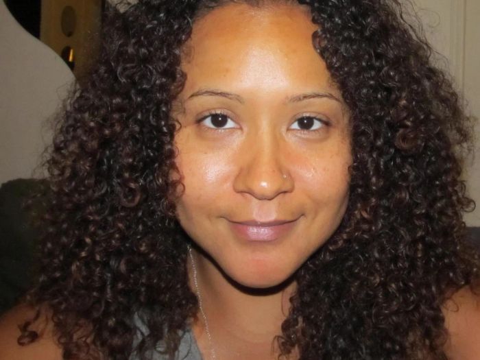 A photo of a user with bright, glowing skin, free of breakouts or acne scars.