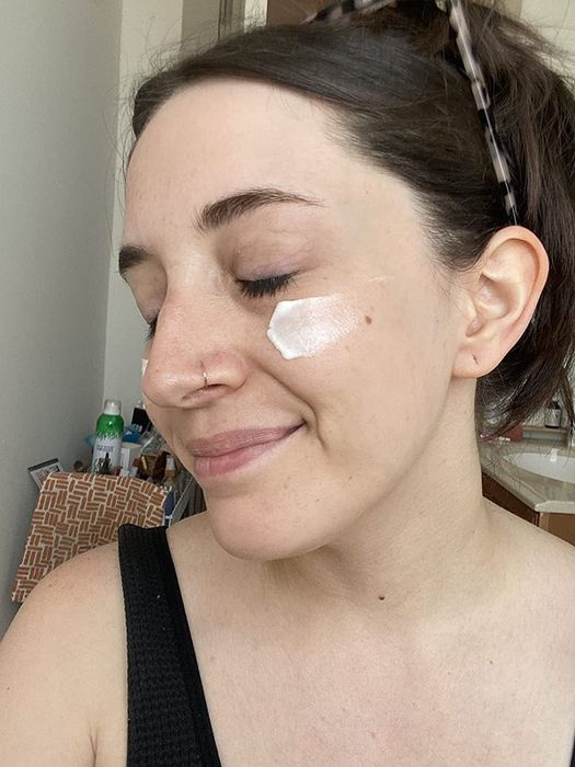 a photo of a reviewer with a dab of Cloud Whip on their face