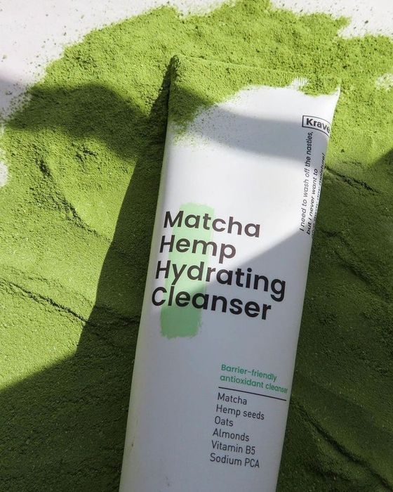 The cleanser placed on top of matcha powder