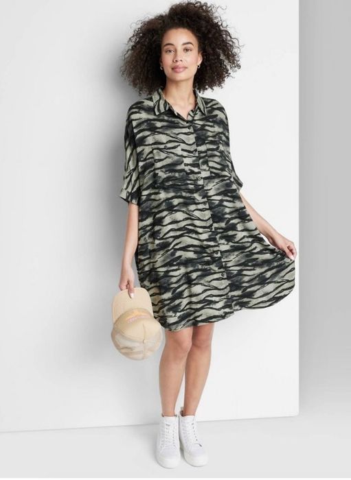 A model showcasing a zebra print dress.