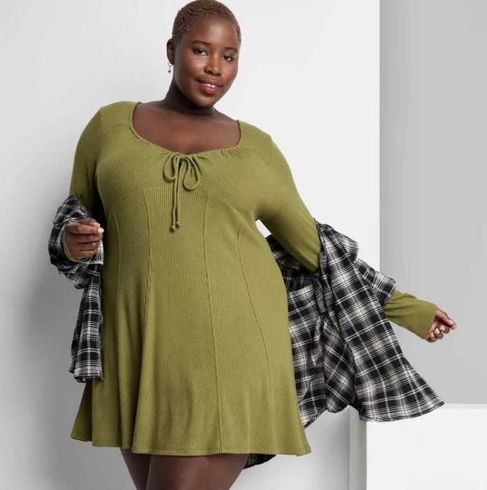 A green knit long sleeve dress that blends comfort and style effortlessly.