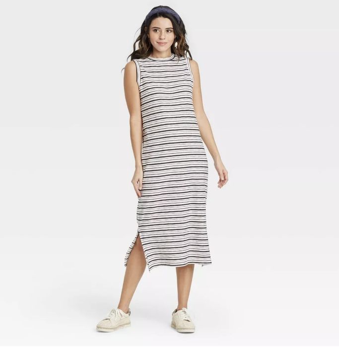 A striped cream sleeveless maxi dress, combining style and comfort for every occasion.