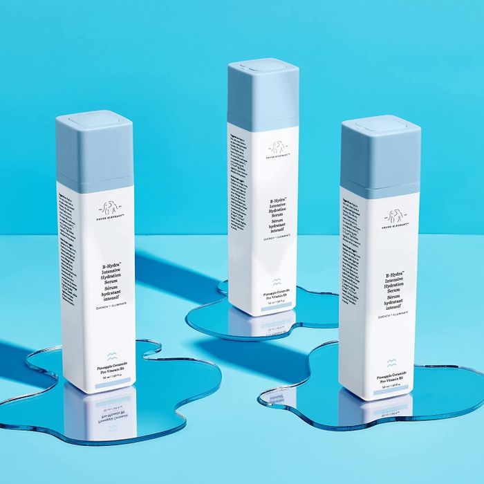 the serum in a white and baby blue bottle