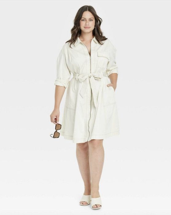 A white long-sleeve belted dress that exudes both grace and warmth for any occasion.