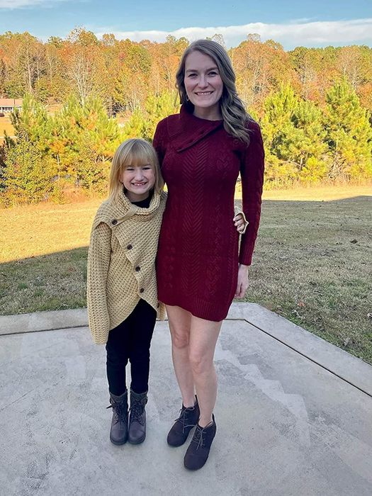 Reviewer modeling a red cowl-neck sweater dress