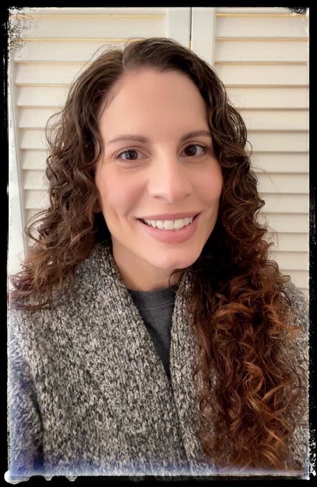 A reviewer showcasing the foundation balm in use