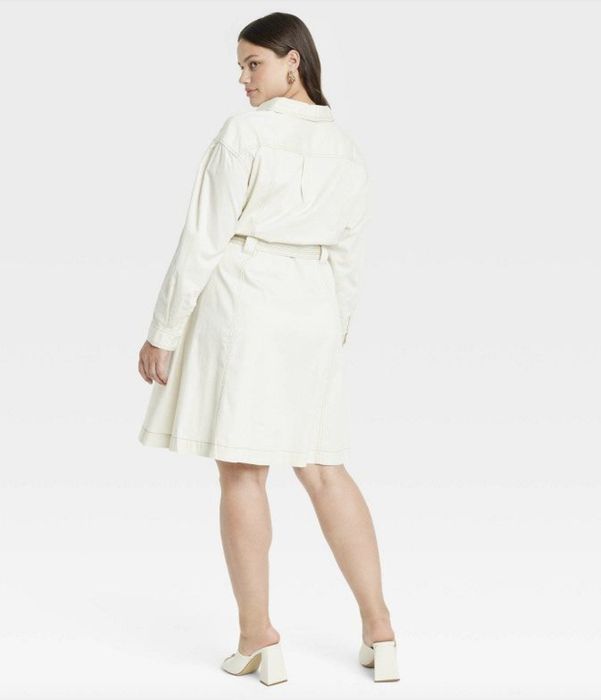 A white long-sleeve belted dress seen from the back, offering an elegant and flattering silhouette.