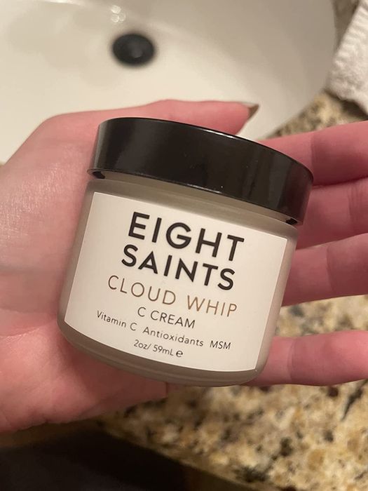a reviewer holding the Eight Saints Cloud Whip Vitamin C Cream