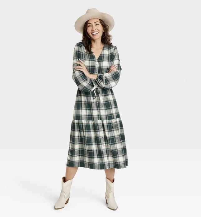 A green plaid maxi dress, designed to be the perfect addition to any occasion, adding a timeless touch to your wardrobe.