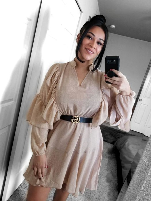 A reviewer’s photo of the tan dress