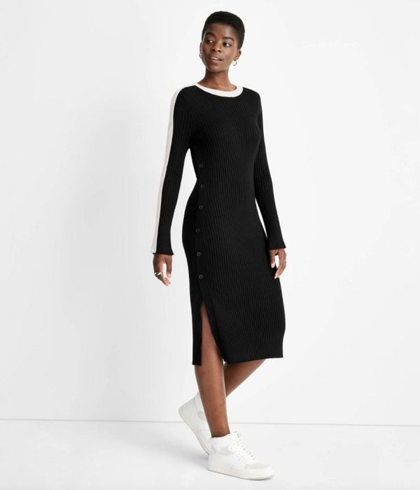 A ribbed sweater dress in classic black and white, perfect for any occasion.