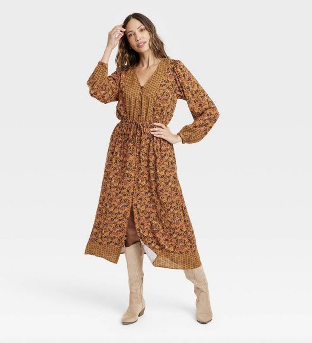 A floral-printed, rust-colored long dress with a flattering silhouette.