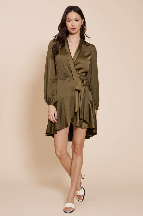 Model rocking the olive green wrap dress, perfect for any fall occasion.