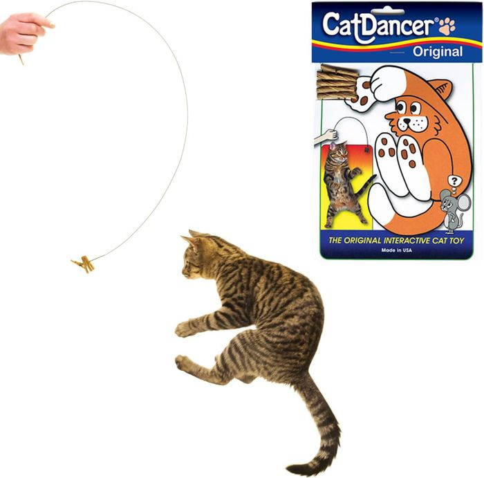 A hand holds the Cat Dancer Original toy as a tabby cat leaps to play with it. The packaging features a cartoon cat and the text: