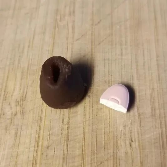 A pill resting next to a pill pocket, ready to be hidden inside for a quick, easy medication session.