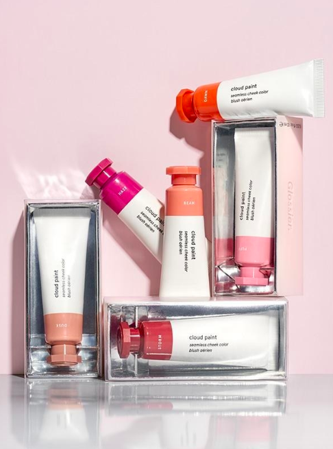 An array of blush tubes in various shades of pink, peach, and purple, beautifully displayed