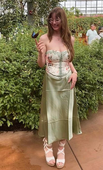 A reviewer modeling the apple green skirt